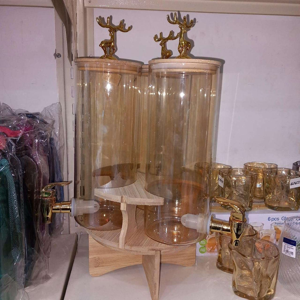 Elegant Triple Section Glass Beverage Dispenser with Gold Deer Lid, Wooden Stand, Round Design, Perfect for Gatherings.