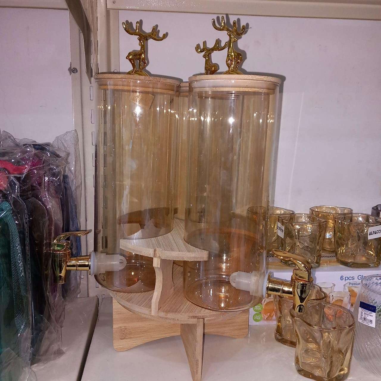Elegant Triple Section Glass Beverage Dispenser with Gold Deer Lid, Wooden Stand, Round Design, Perfect for Gatherings.